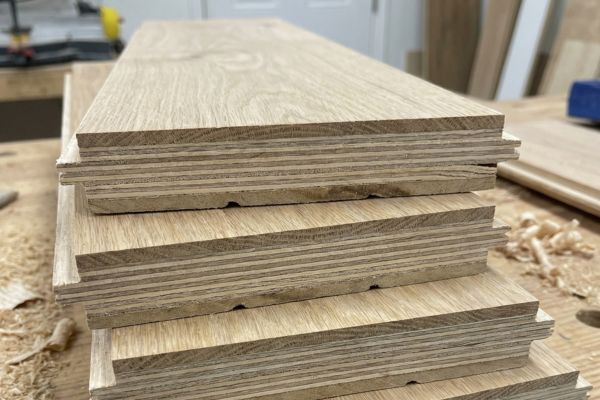 Engineered hardwood flooring planks showing cross-ply construction